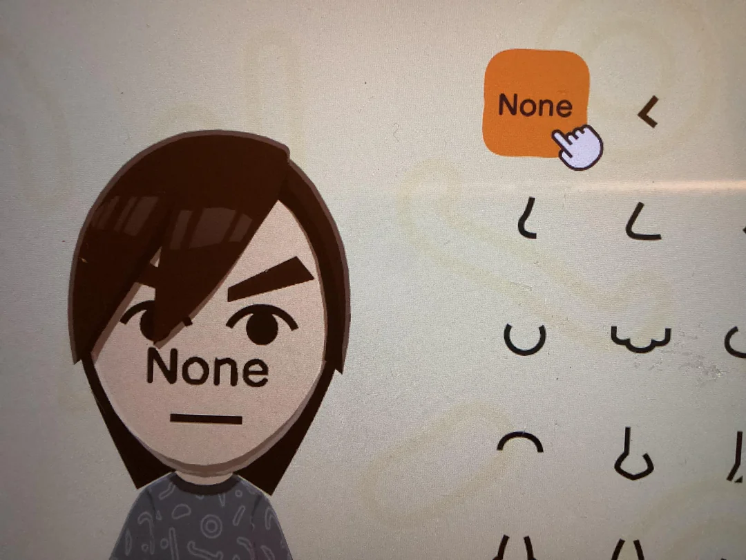 An image from mii creator where the 'none' opton for noses replaces the nose with the word none.
